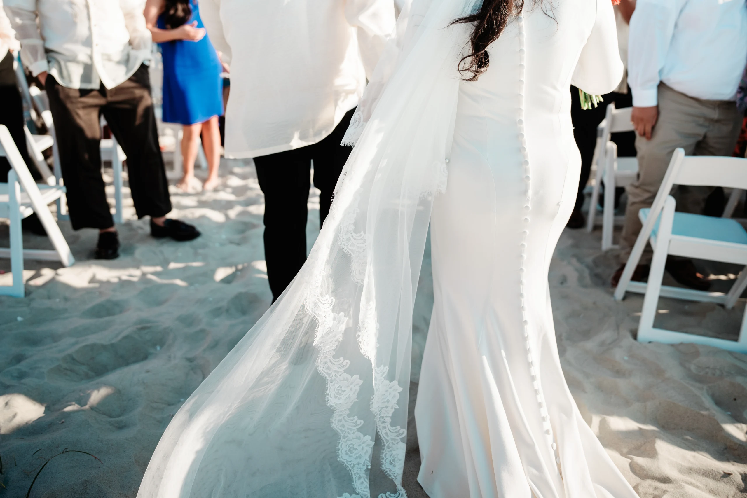 A joyful piggyback ride moment at night with a couple in formal attire.
