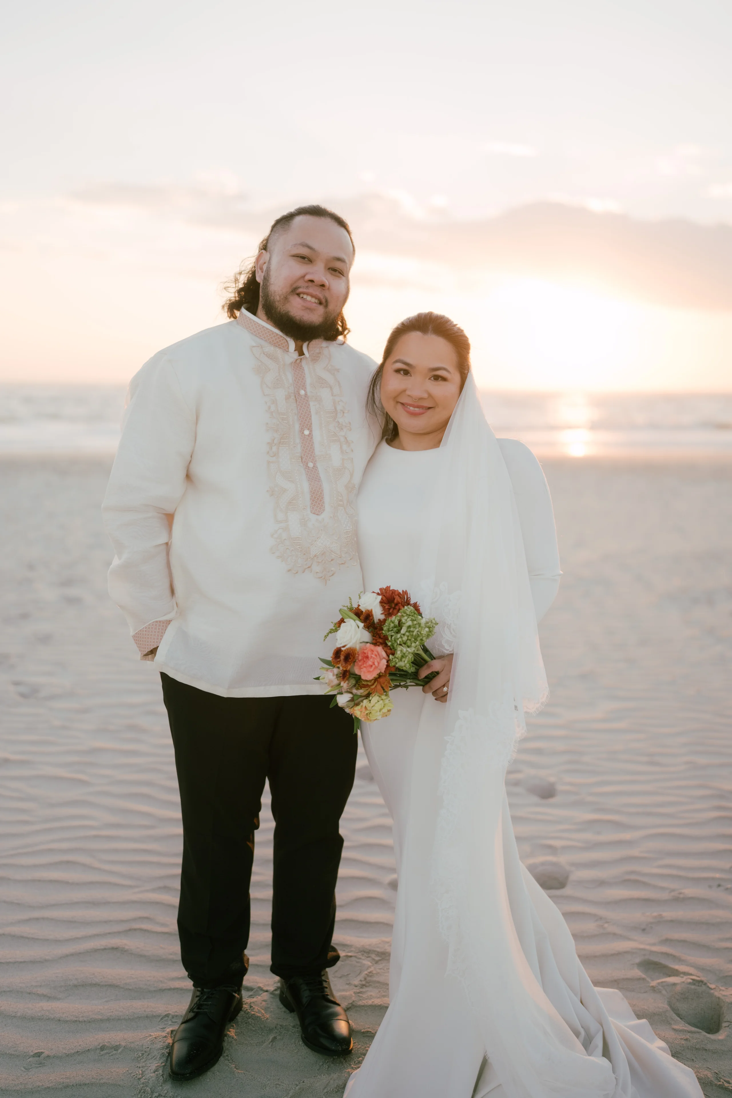 Wedding preparation scene with formal attire adjustments in mirror-filled room.