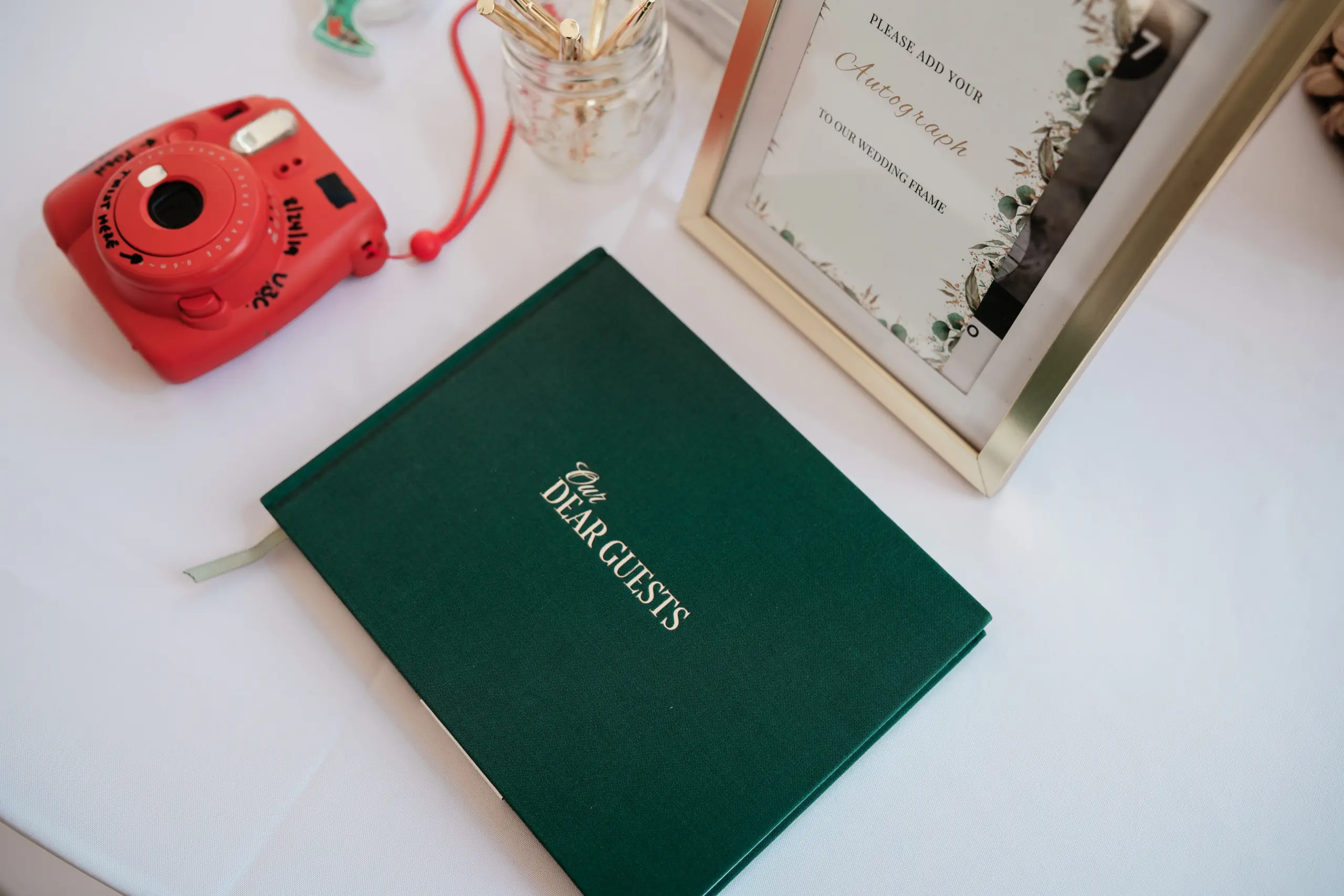 Bright yellow food truck named Myrna's Fil-Am Food with red lettering parked on grass.