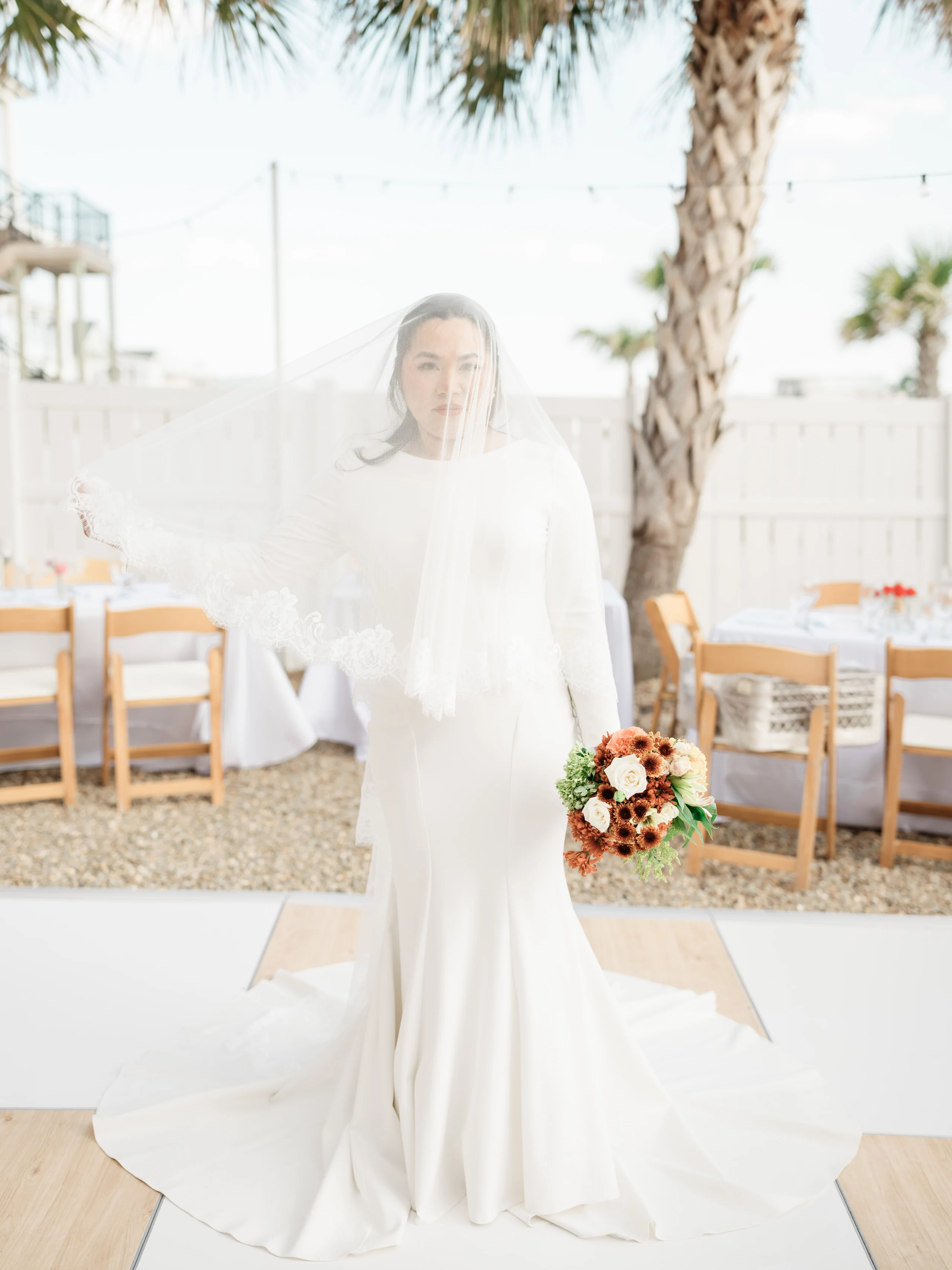 Two fried eggs with bright yellow yolks served atop a bed of seasoned hash on a cast iron skillet.