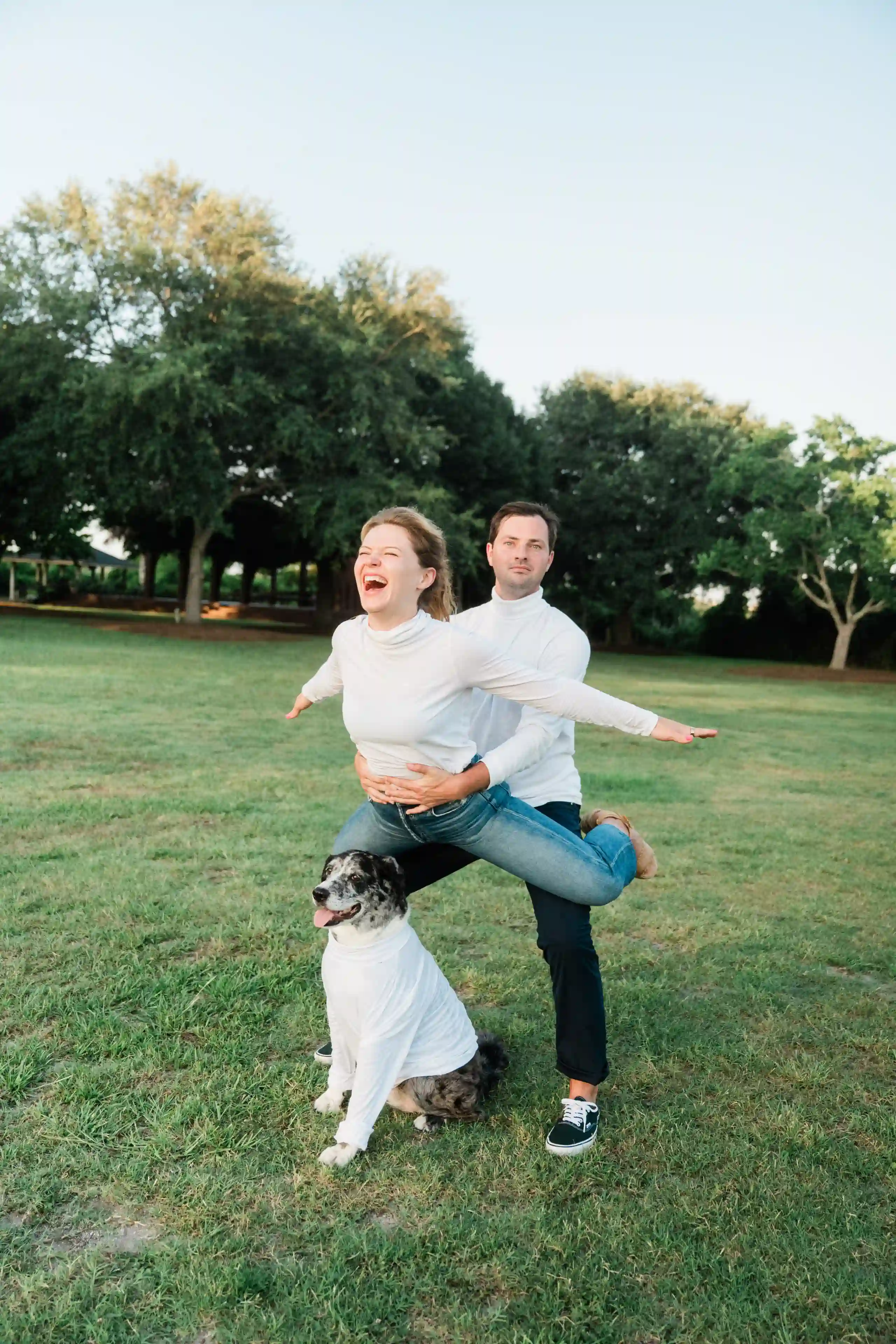 Couple taking engagement photos on a beautiful beach